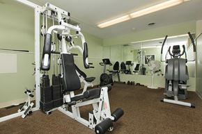 Troy apartment for rent - a gym with weights and other equipment in a building