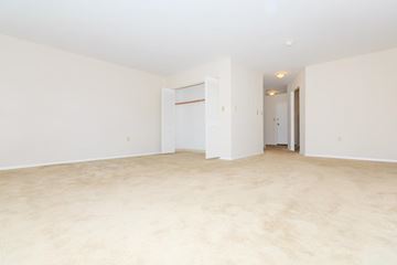 Troy apartment for rent - the spacious living room and dining room of an empty apartment