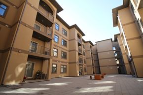 Regina apartment for rent - A large, empty courtyard surrounded by apartment buildings.