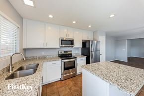 Phoenix house for rent - a kitchen with granite counter tops and stainless steel appliances