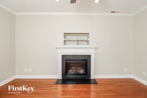 Colfax house for rent - a living room with a fireplace and a wooden floor