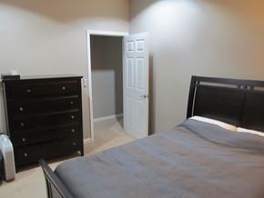 Chicago apartment for rent - a bedroom with a bed and dresser and a closet