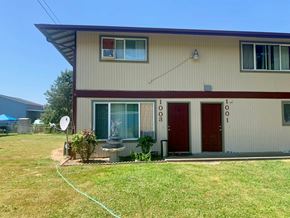 Kelso apartment for rent - a yard in front of a house with a yard hose