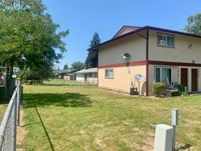 Kelso apartment for rent - a house with a yard and a fence in front of it