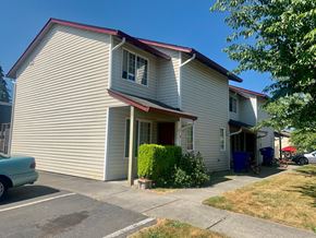 Kelso apartment for rent - A house with a red roof and a car parked in front.