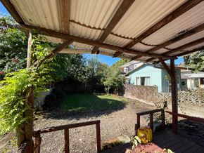 Kelso house for rent - a view of a backyard from under a covered patio