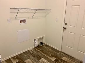 Kelso house for rent - a closet in a bedroom with a door and a shelf on the wall