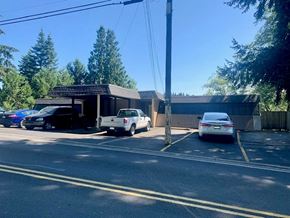Longview apartment for rent - a parking lot with cars in front of a building