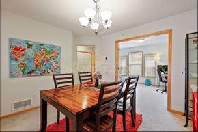 Plymouth house for rent - a dining room with a wooden table and chairs