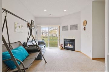 Plymouth house for rent - a living room with a couch and a fireplace