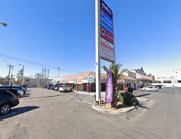 North Hills apartment for rent - a gas station at the corner of a parking lot