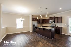 Charlotte house for rent - a kitchen with a large island in the middle of it