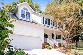 Greensboro house for rent - a white house with a white garage door