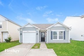 Camby house for rent - A house with a garage door and a window is for sale.