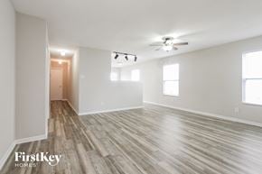 Camby house for rent - A spacious room with wooden flooring and a ceiling fan.