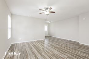 Camby house for rent - A room with wooden flooring and a ceiling fan.