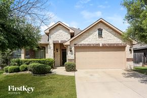 Crowley house for rent - a house with a driveway and a garage door