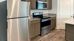 Forest Grove house for rent - A kitchen with a stainless steel refrigerator and a stainless steel oven.