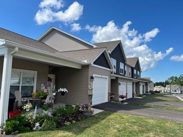 Penn Yan apartment for rent - A row of houses with a clear blue sky above them.