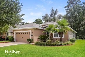 Jacksonville house for rent - a house with a palm tree in front of it