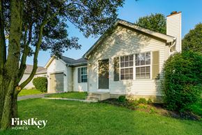 Grove City house for rent - A house with a tree in front of it.