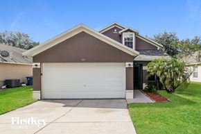 Haines City house for rent - a white garage door in front of a house