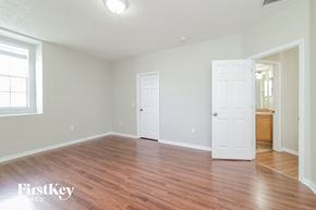 Haines City house for rent - a living room with a hard wood floor and a white door