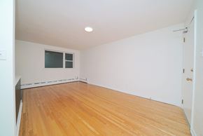 Winnipeg apartment for rent - an empty room with wood floors and a window