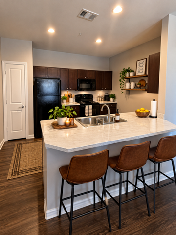 Kaufman apartment for rent - A kitchen with a white countertop and brown barstools.
