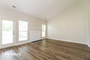 Winston-Salem house for rent - a living room with wood flooring and white walls and doors