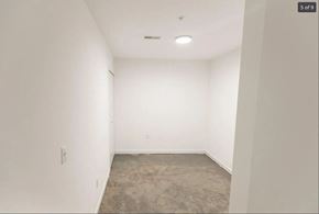 Detroit apartment for rent - an empty room with white walls and a cement floor