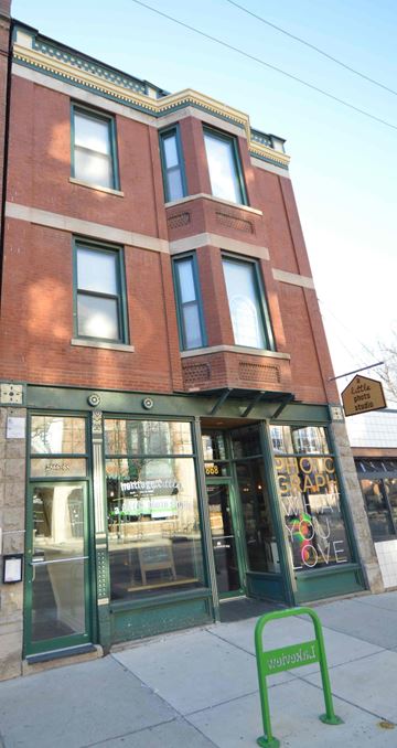 Chicago apartment for rent - a building with a green sign in front of it