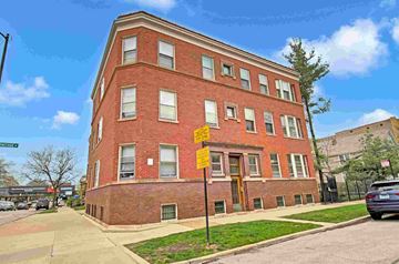 Chicago apartment for rent - a red brick building on the corner of a street