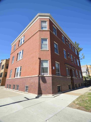 Chicago apartment for rent - a tall brick building with a sidewalk in front of it