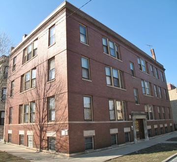 Chicago apartment for rent - a red brick building on the corner of a street
