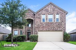 Richmond house for rent - a brick house with a white garage door