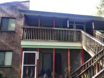 Tallahassee apartment for rent - the front of a house with a wooden balcony