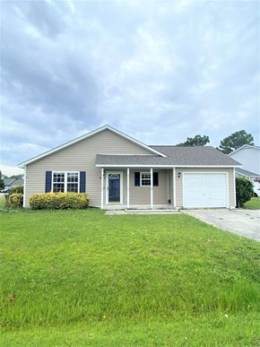 Hubert house for rent - A house with a grey roof and a white garage door.