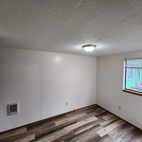 Longview apartment for rent - A room with wooden floors and a window.