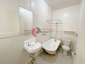 Longview apartment for rent - A white bathroom with a sink, toilet and bathtub.