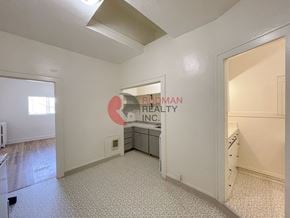 Longview apartment for rent - A room with a bed and a desk in it.