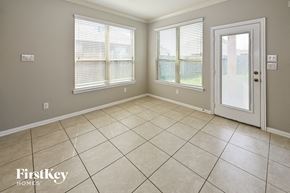Baytown house for rent - a empty living room with windows and a door