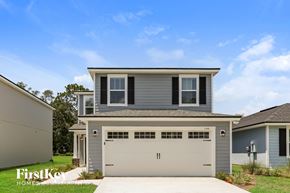 Jacksonville house for rent - a gray house with a white garage door
