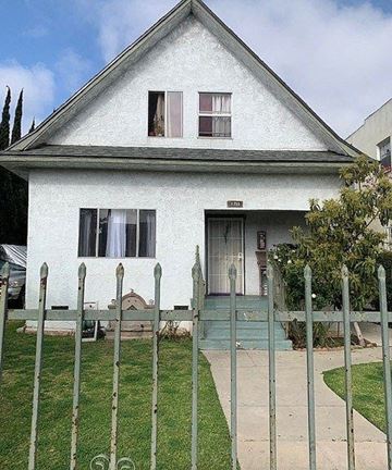 Long Beach apartment for rent - a white house with a fence in front of it