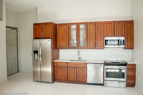 Charlestown apartment for rent - a kitchen with wooden cabinets and stainless steel appliances