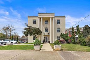 Jackson apartment for rent - the front of a building with columns and a sidewalk