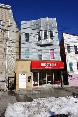 Bronx apartment for rent - a building with a red sign on the front of it