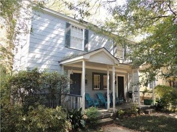 Jackson apartment for rent - a blue house with a porch with blue chairs