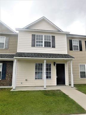 Jacksonville house for rent - A two-story house with a black front door and white trim.
