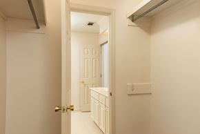 Brandon apartment for rent - a bathroom with a sink and a mirror and a door